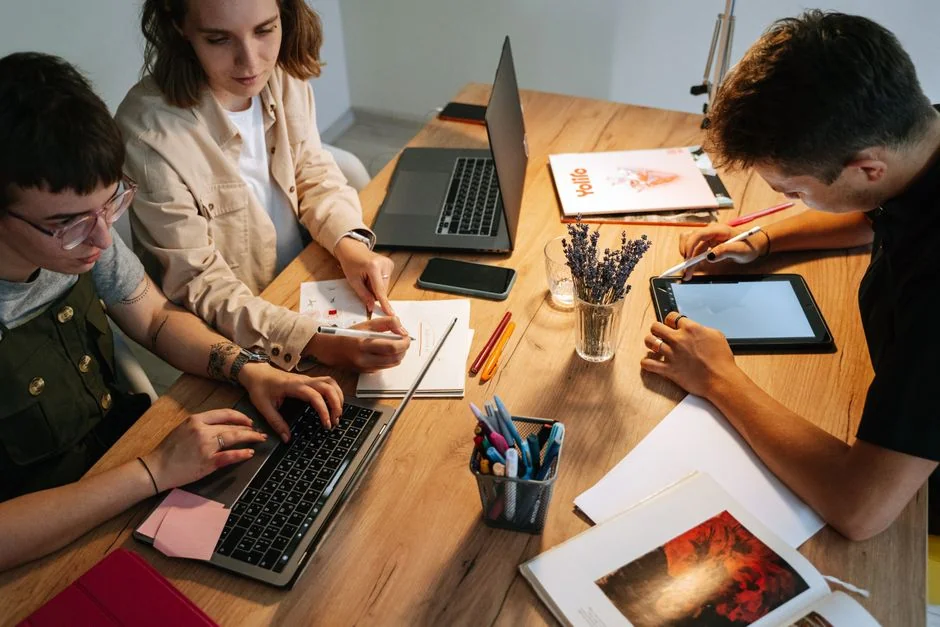 A person using a laptop to browse stock photo websites. Freelancing work in a cozy setting.